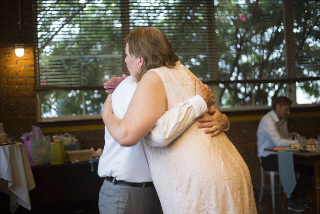 Mother hugs son after Ypsilanti wedding dance