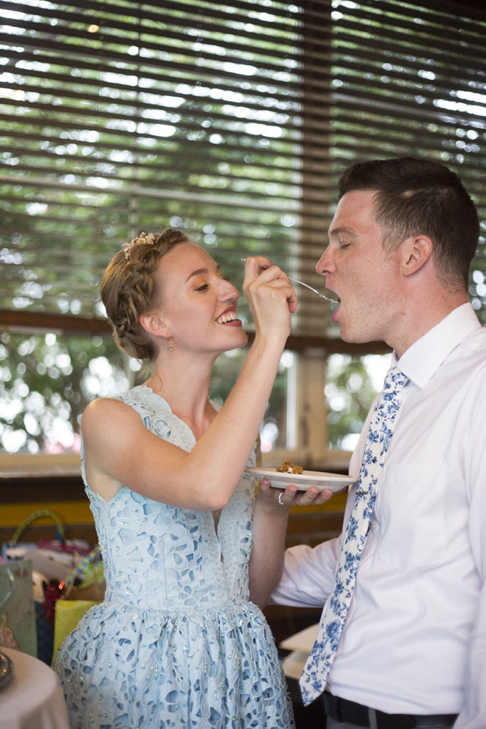 Ypsilanti Wedding couple feeding each other cake