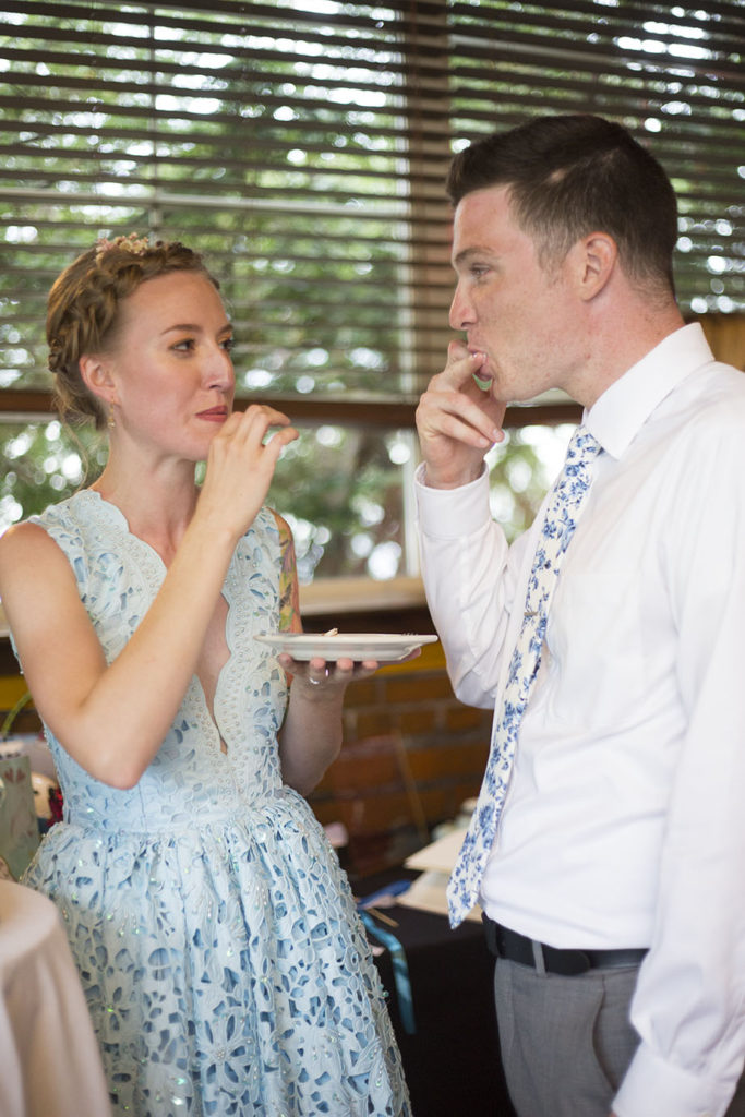 Licking the frosting off their fingers Ypsilanti wedding