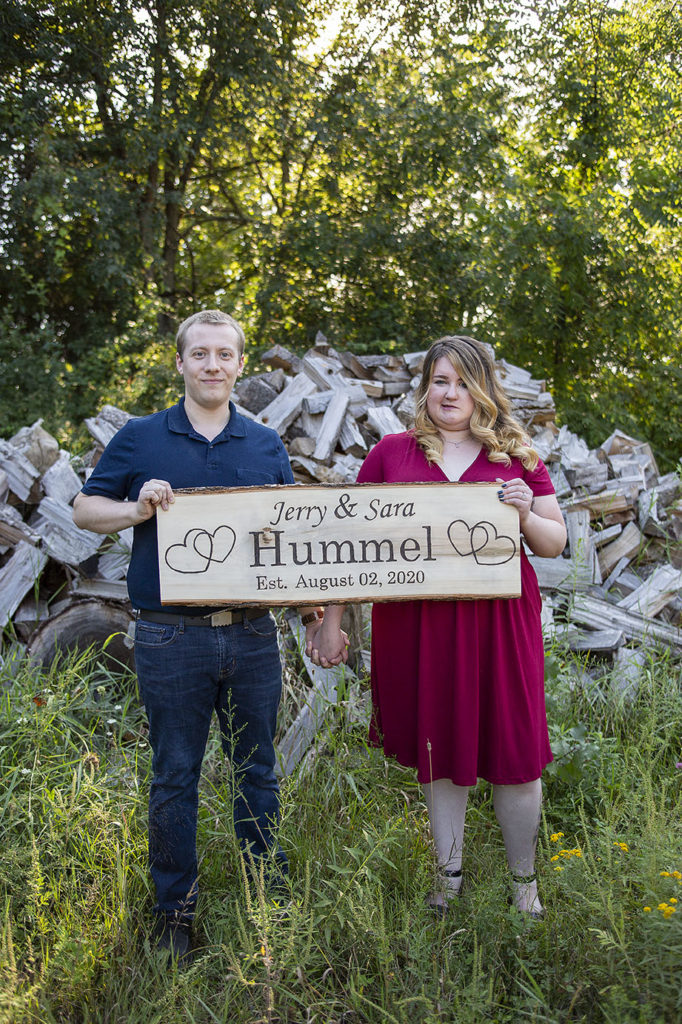 Pinckey wedding couple poses with handmade sign