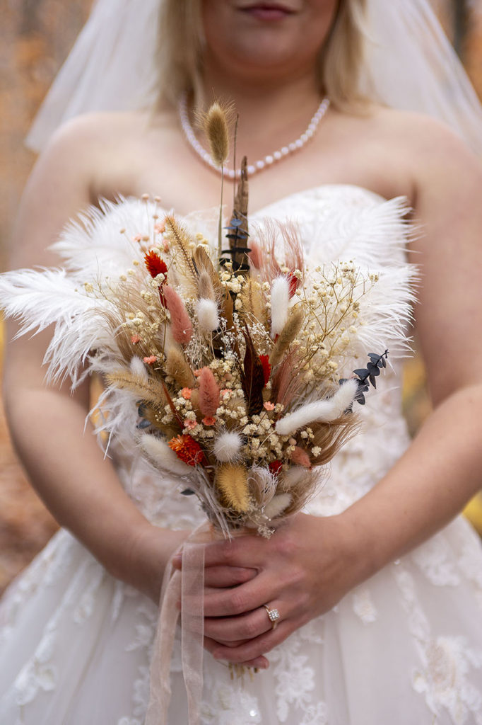 Fall wedding bouquet from dried flowers Tahquamenon Falls elopement