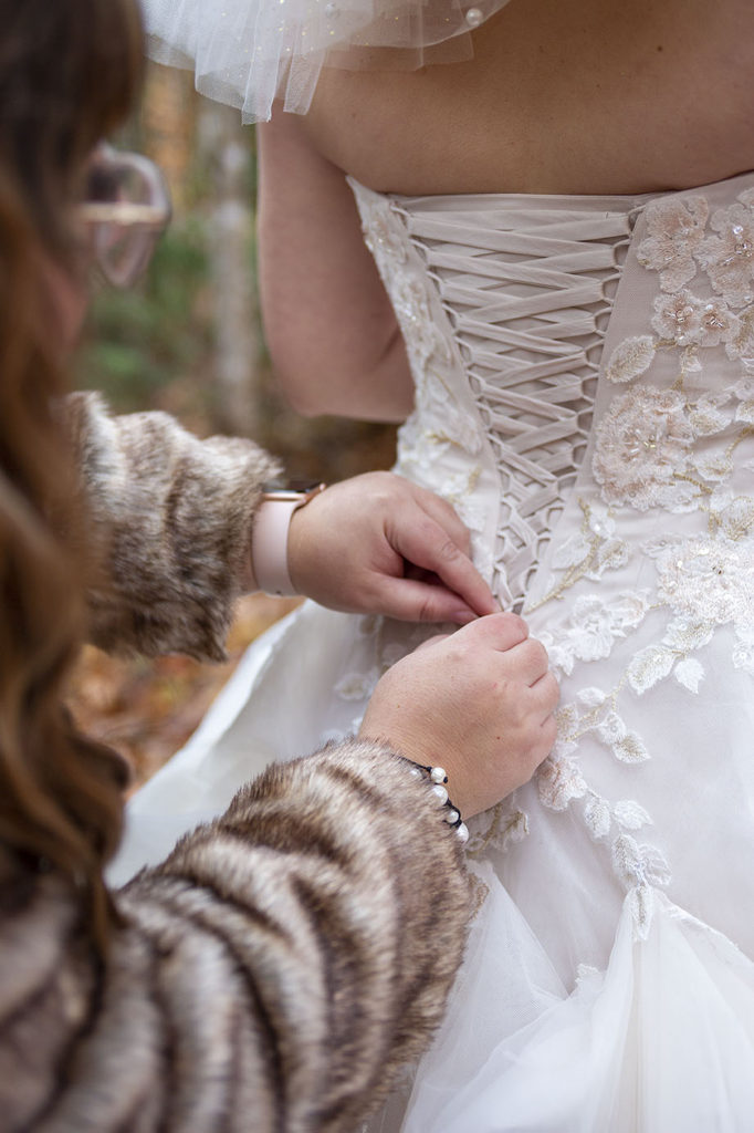 Lacing up of northern Michigan wedding dress