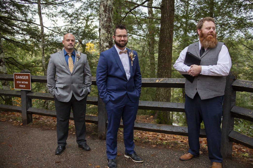 Groom anxiously waits for bride at Tahquamenon Falls elopement