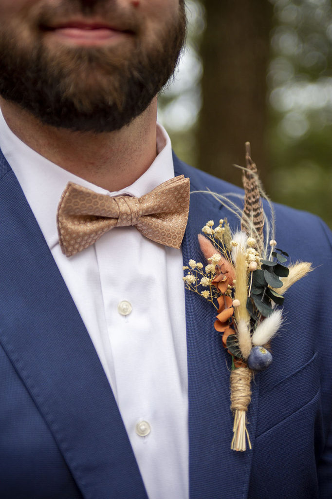 Fall boutonniere of dried flowers at Tahquamenon Falls elopement