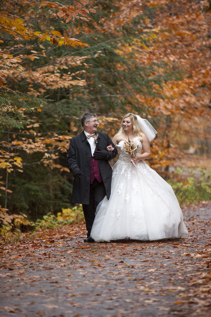 Bride and father at Tahquamenon Falls elopement