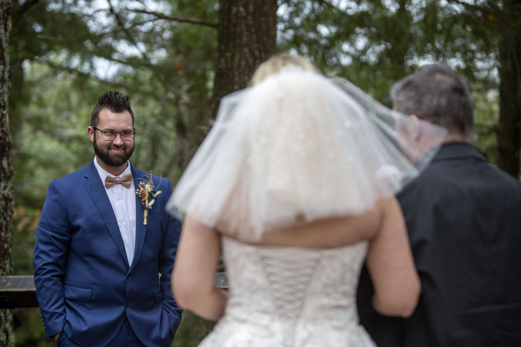 Upper Peninsula groom smiling