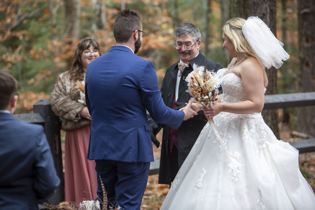 Father handing off bride at Paradise MI elopement