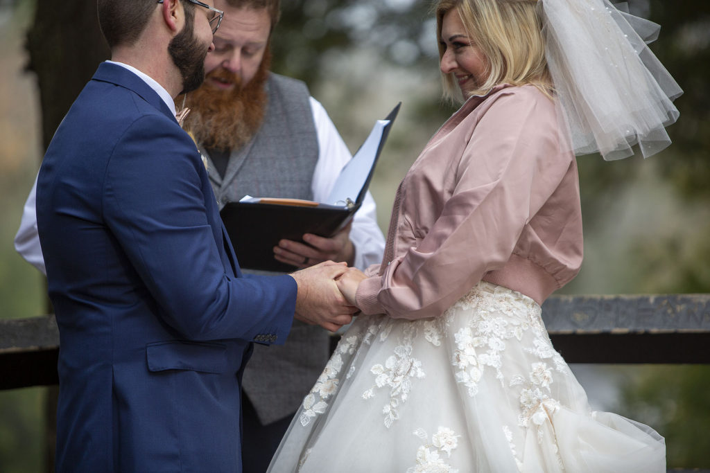 Bride giggling during ceremony Tahquamenon Falls elopement