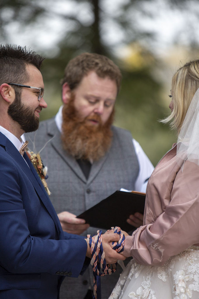 Tahquamenon Falls elopement couple holding hands