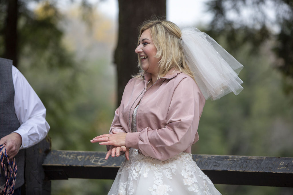 Bride laughing at Tahquamenon Falls elopement