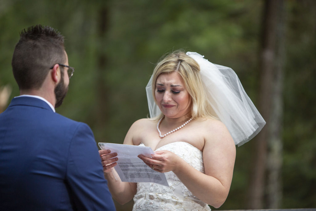 Bride tearfully reads vows at Paradise MI Tahquamenon Falls wedding