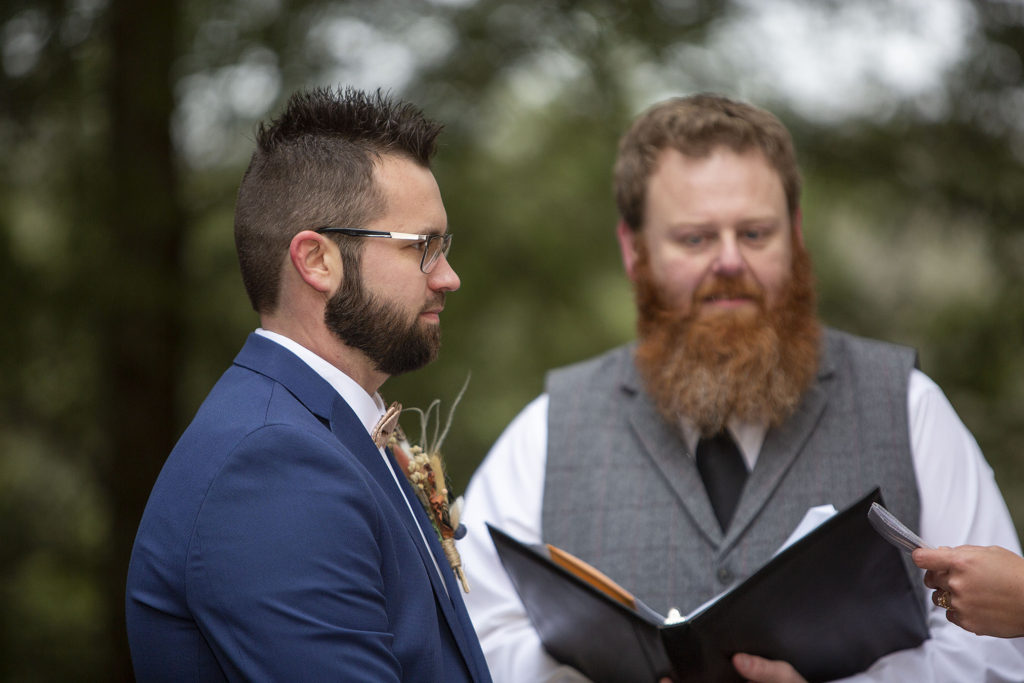 Groom with navy and blush attire Tahquamenon Falls elopement