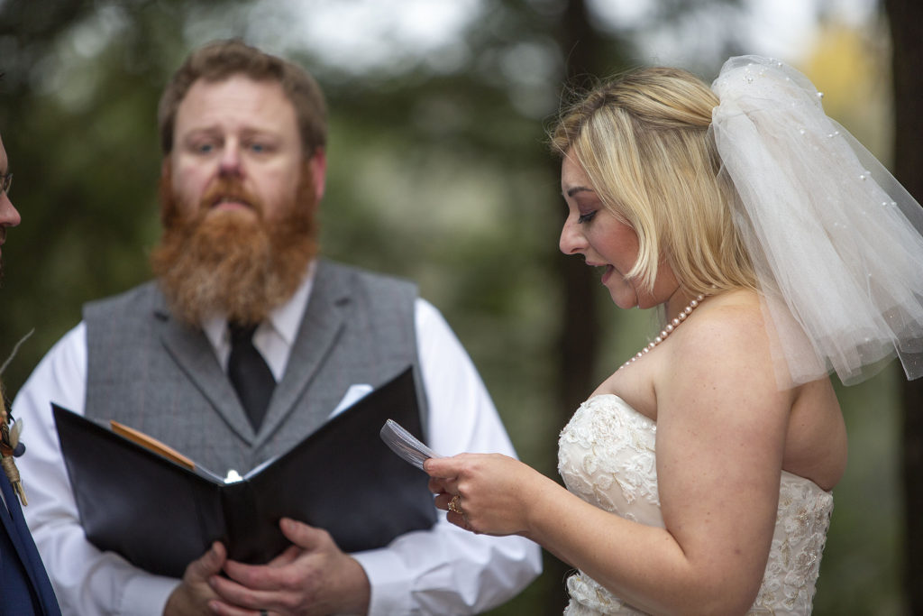 Bride reading wedding vows during outdoor northern Michigan wedding