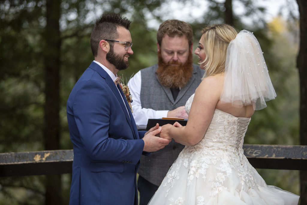 Couple smiling during Taquamenon Falls elopement