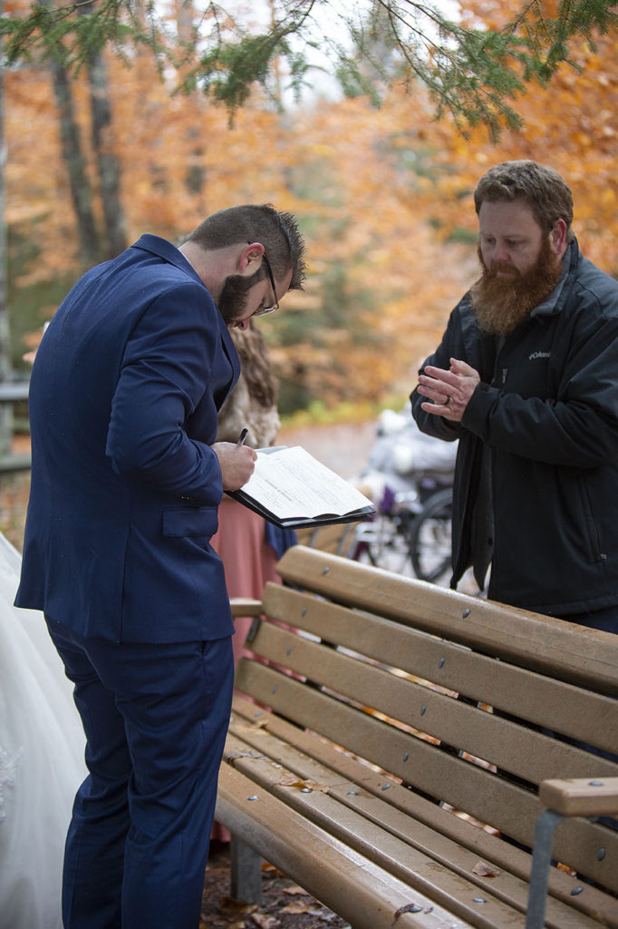 Signing of the marriage license Tahquamenon Falls elopement