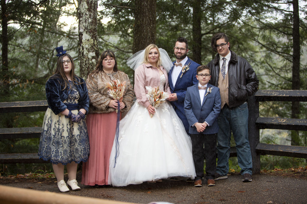 Tahquamenon Falls elopement couple with wedding guests