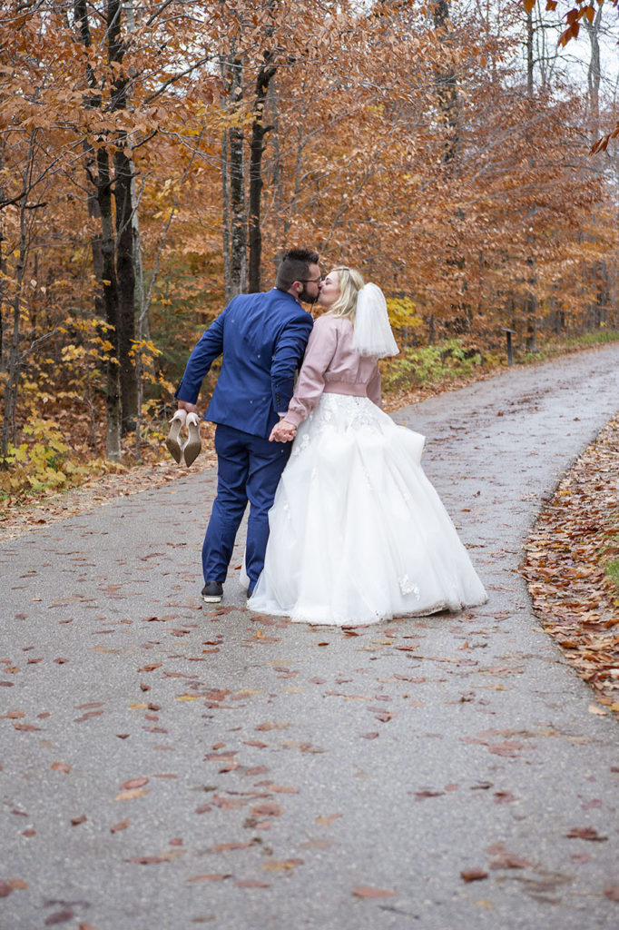 Couple kissing after their fall northern Michigan elopement