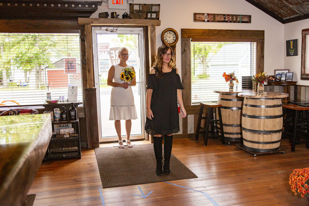 Bridesmaid and bride walking in