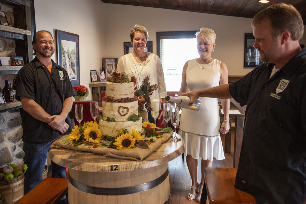 Ore Creek owner pours champagne