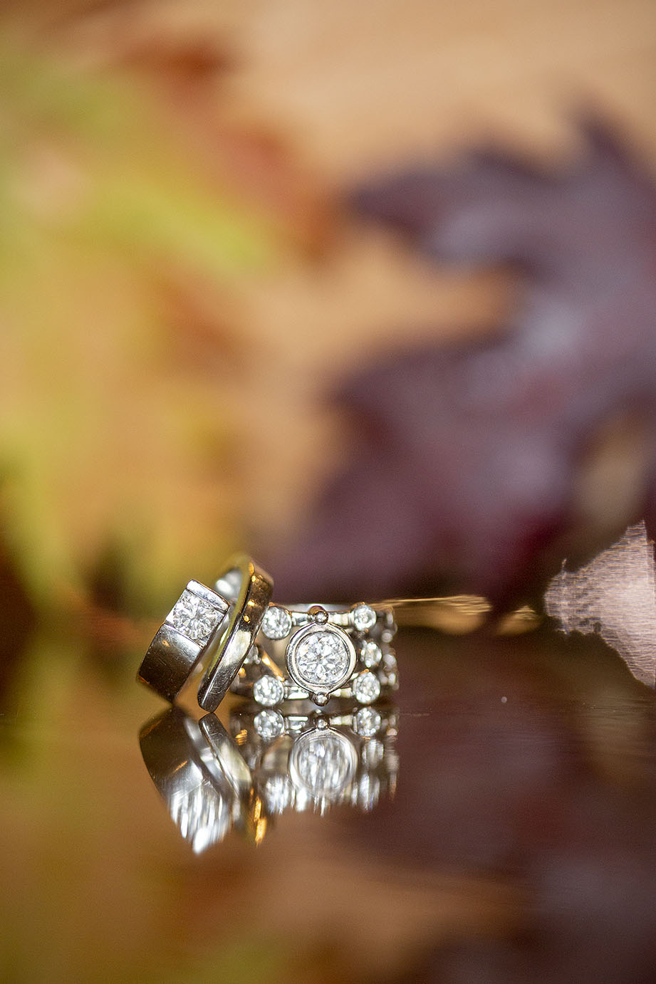 Wedding rings on reflective surface