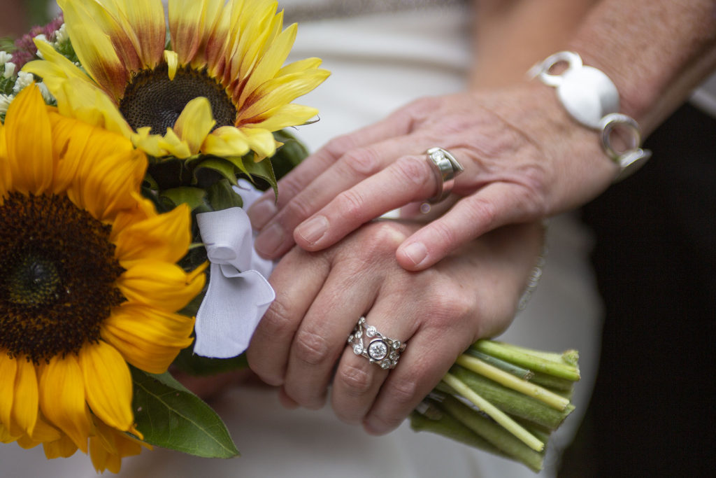 Lesbian wedding rings and sunflowers