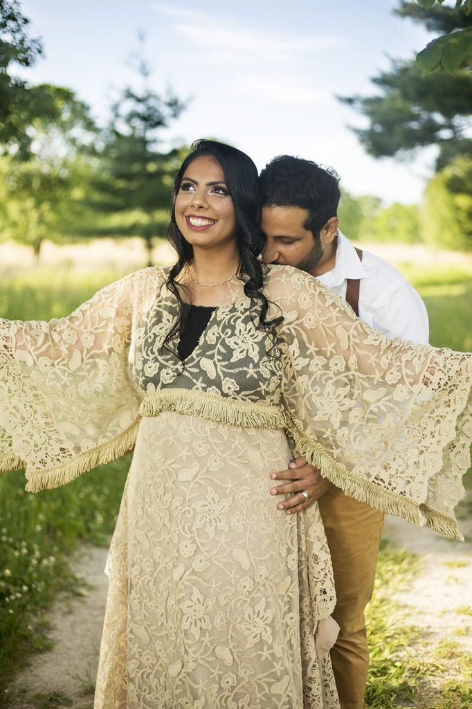 Boho wedding couple snuggles together during Ann Arbor wedding