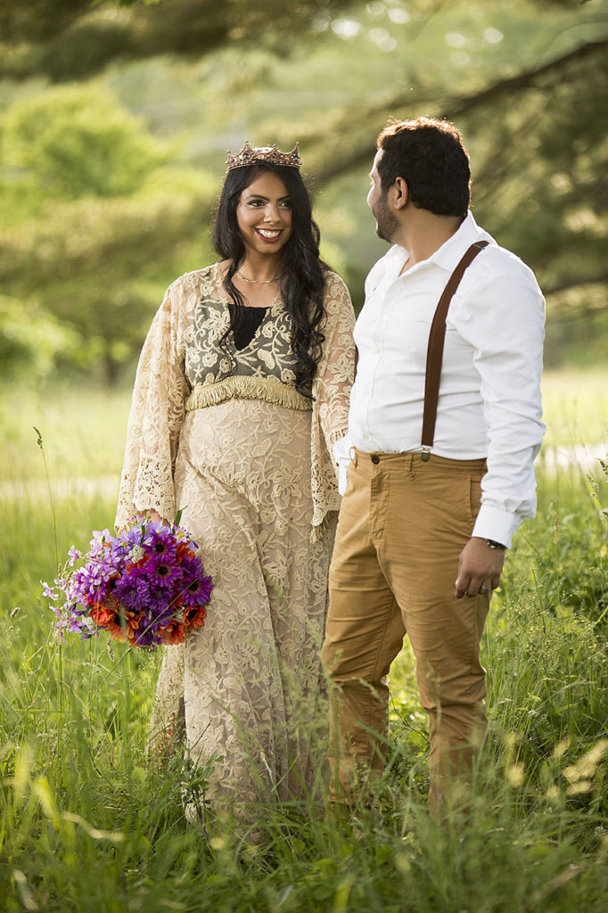 Boho bride and groom smiling at each other at Matthaei Botanical Gardens