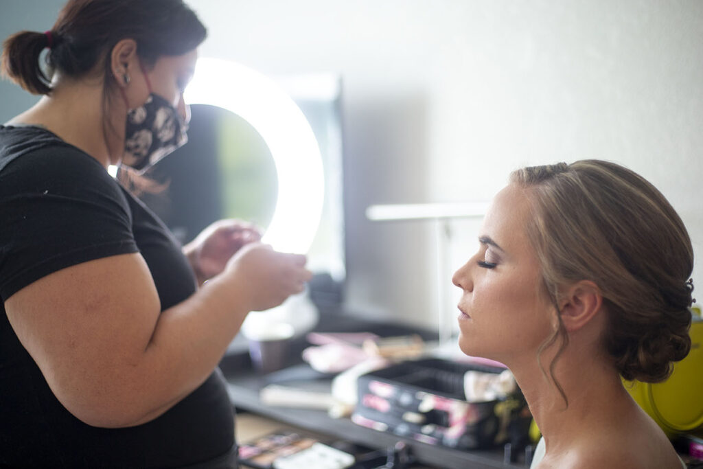 Bride getting her make up done Jackson Michigan wedding