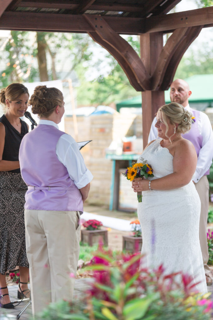 Same sex Michigan wedding couple exchanges vows at their Westland wedding