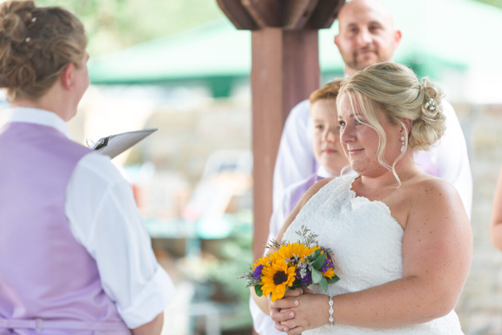 Bride looks at her bride with tears in her eyes at their Westland wedding