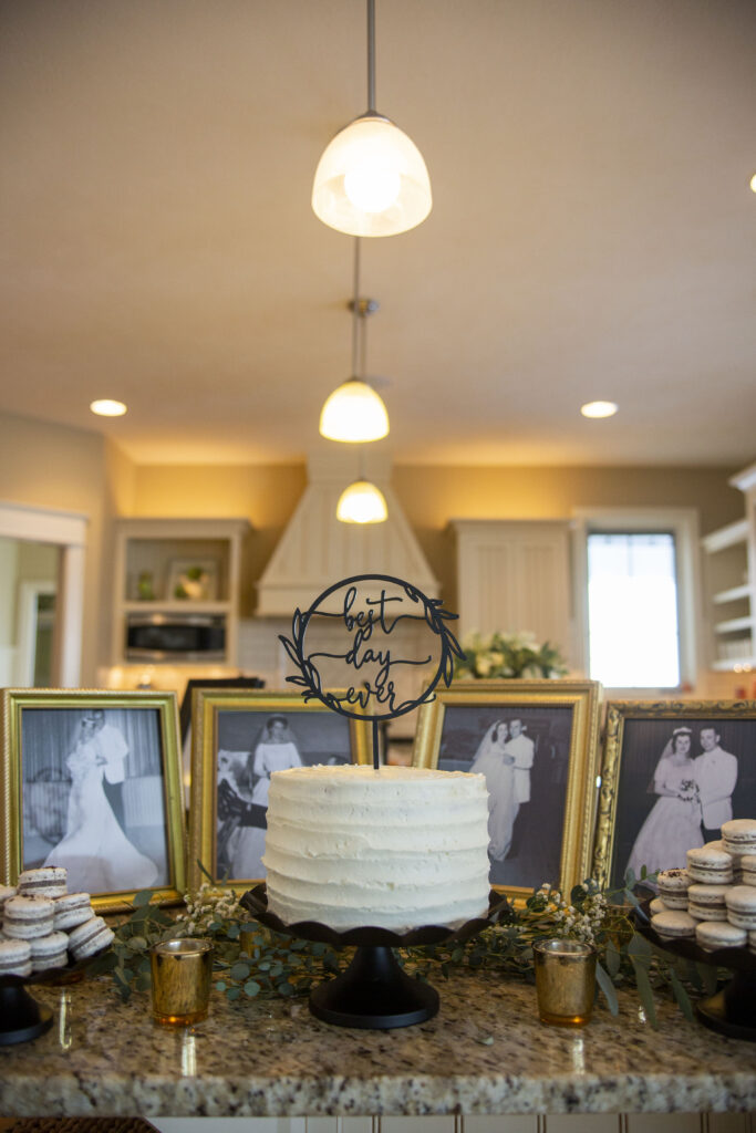 Grandparents wedding photos surrounding wedding cake at Holland, MI AirBNB wedding