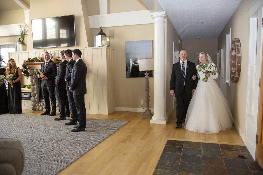 Bride and dad walking down the aisle at Holland, MI AirBNB wedding