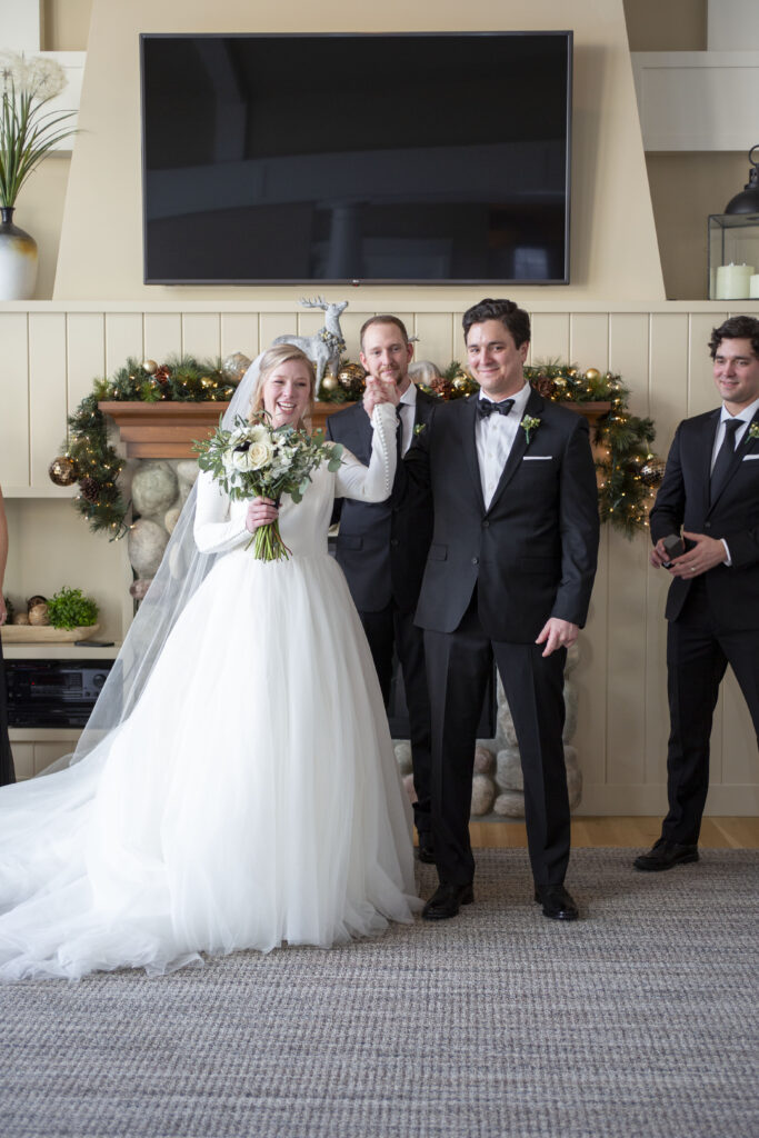 Cheering after being announced as a married couple Michigan AirBNB wedding