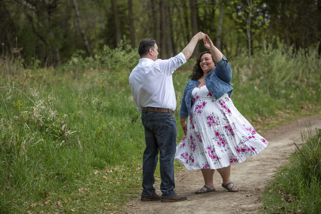 Kensington Metropark engagement couple dances together