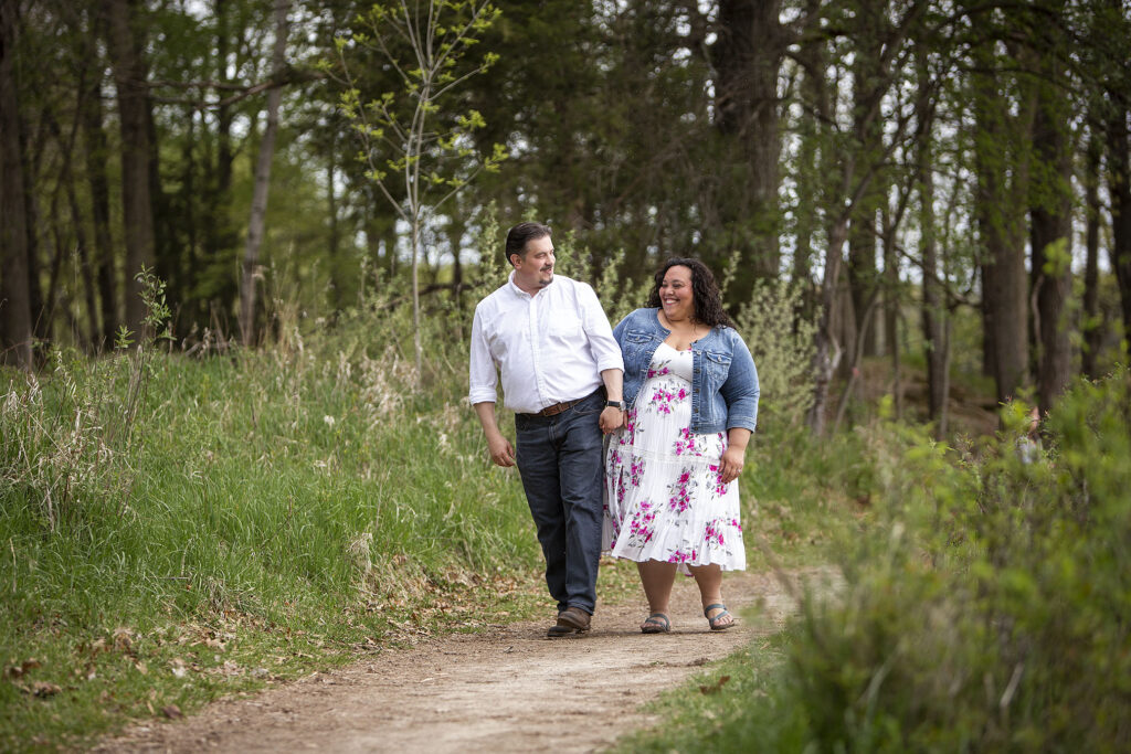 Michigan couple giggling during Kensington Metropark engagement session