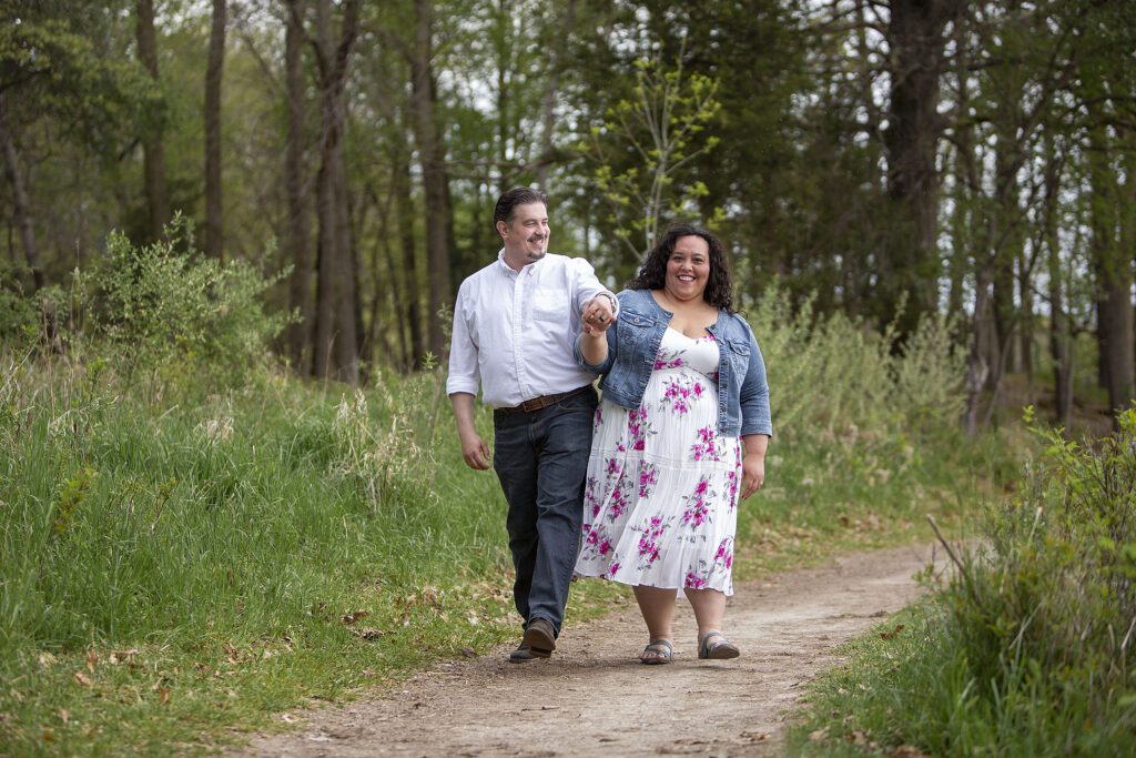 Hip bumps while walking during Kensington Metropark engagement session