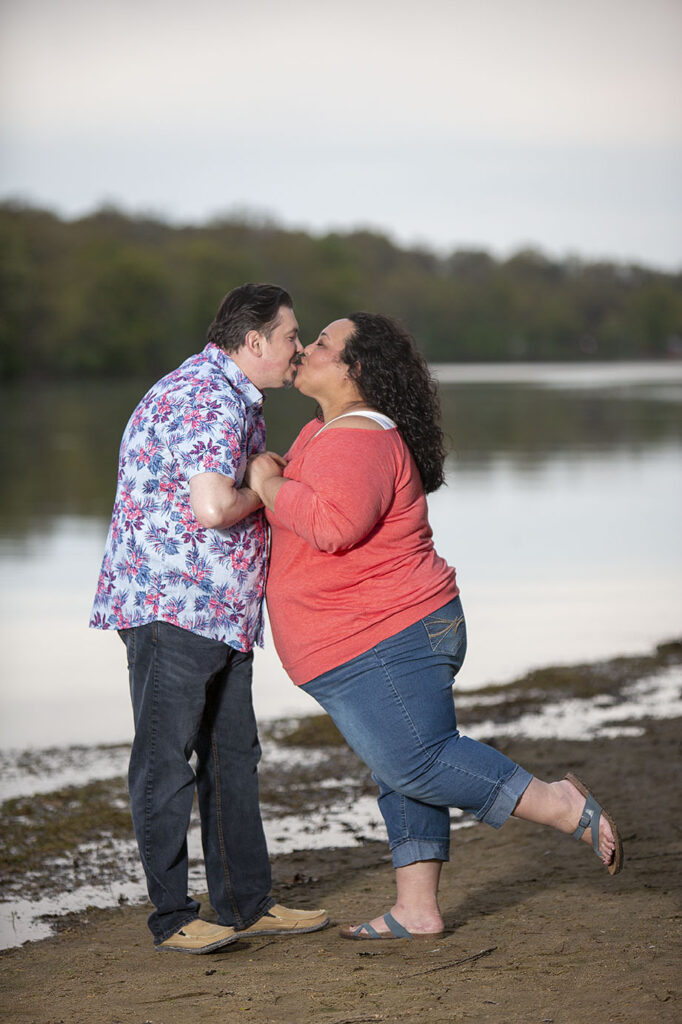 A Disney moment kiss together during their Kensington Metropark engagement session