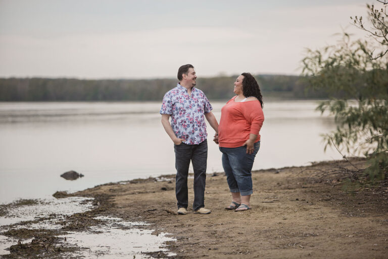 Kensington Metropark engagement session couple walks along the beach