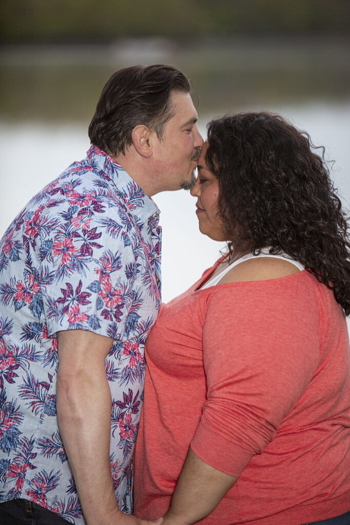 Mel kissing Sally's forehead during their Kensington Metropark engagement session