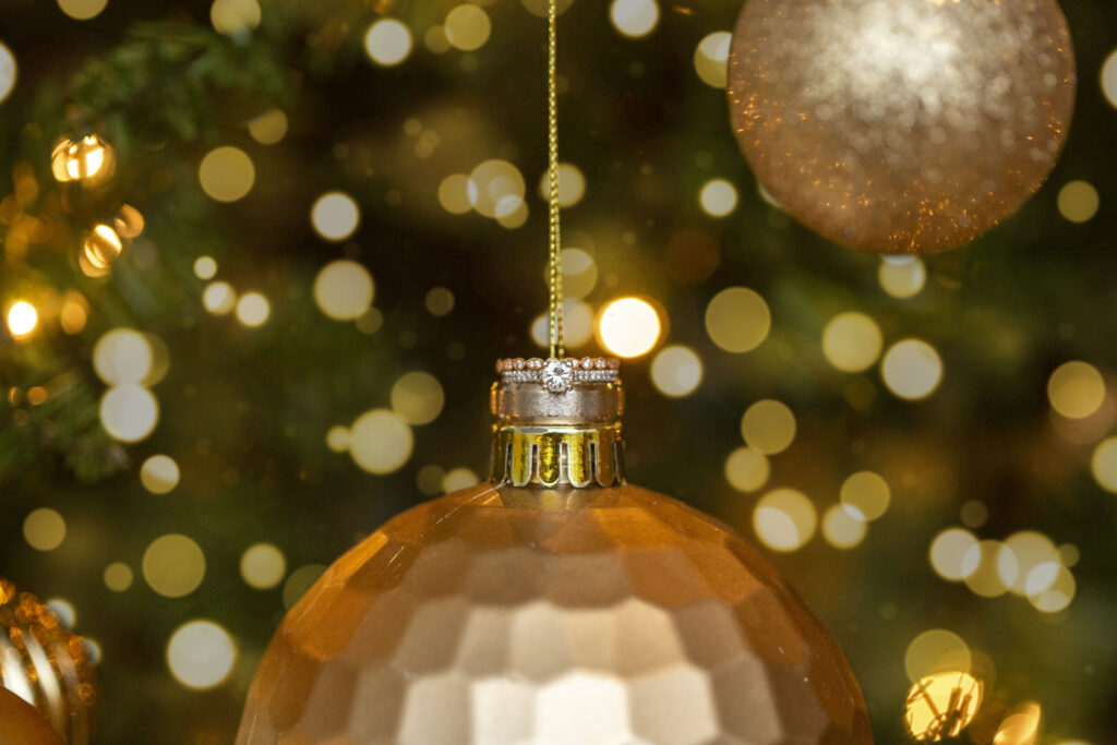 Wedding ring amongst Christmas lights and tree at a west Michigan AirBNB wedding