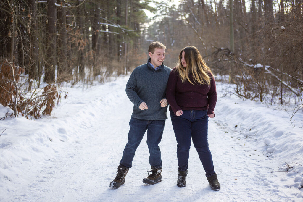 Couple playing together for their winter couple's photos