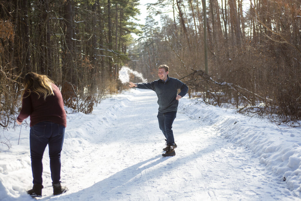 Jerry throws a snowball at Sara winter couple's photos