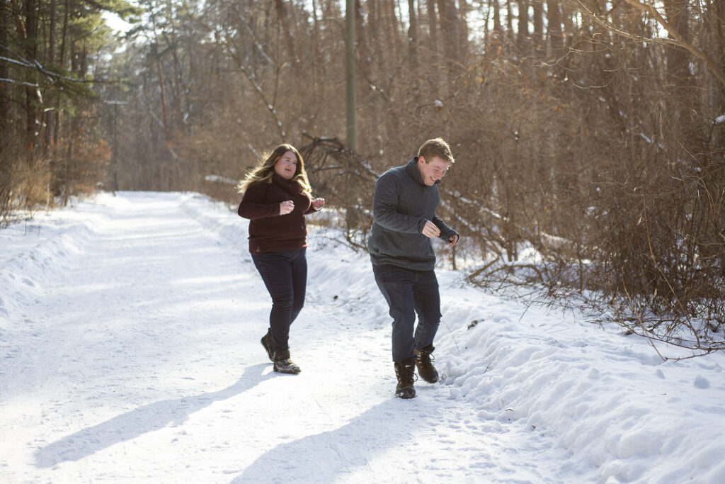 Sara chasing Jerry in the snow winter couple's photos