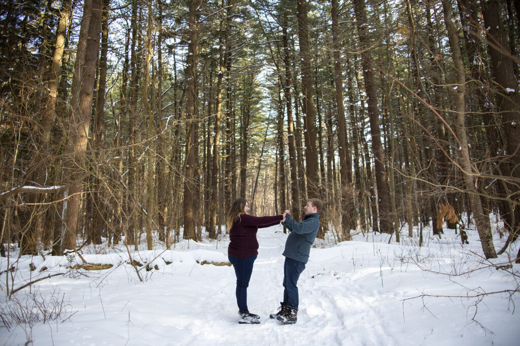 Michigan couple holding hands winter couple's photos