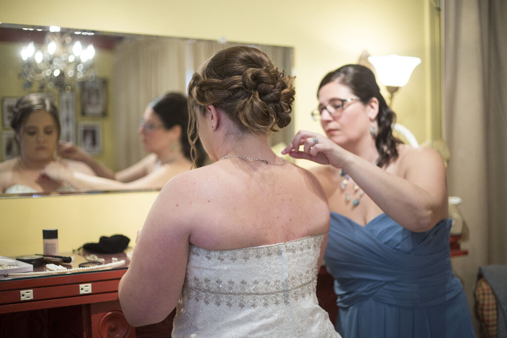 Finishing touches of getting ready before their Plymouth wedding