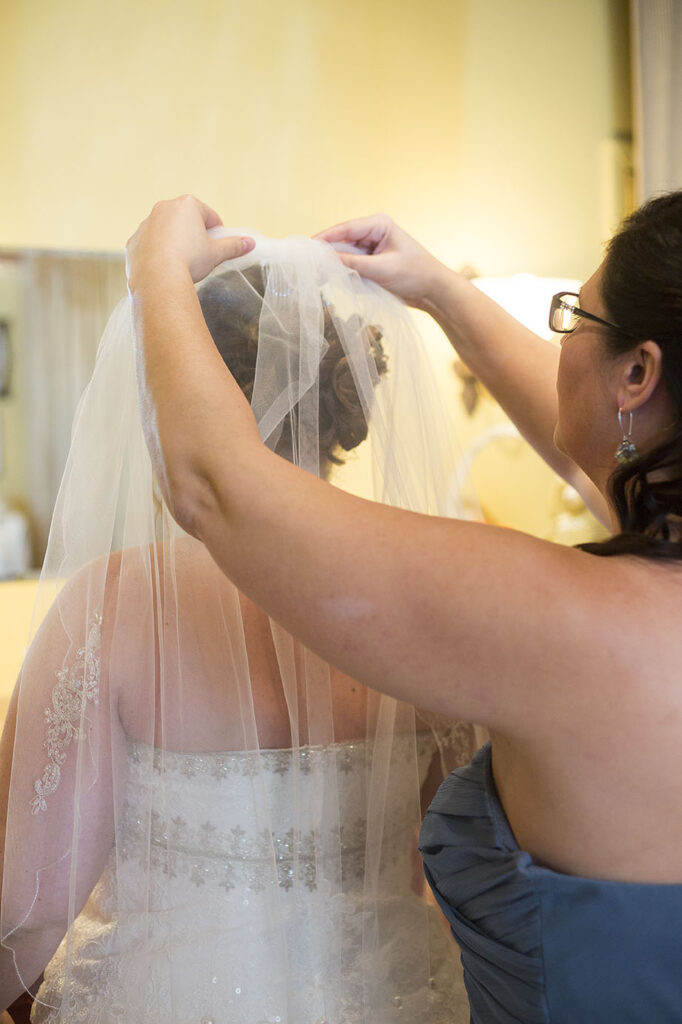 Putting the veil on before her Plymouth wedding