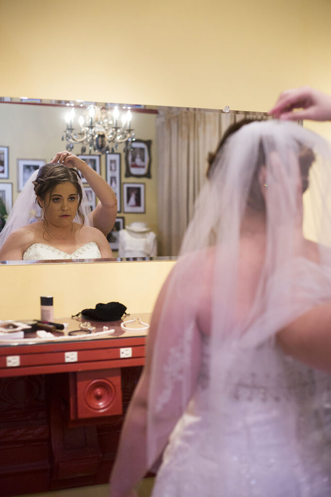 Bride getting her veil adjusted before her Plymouth wedding