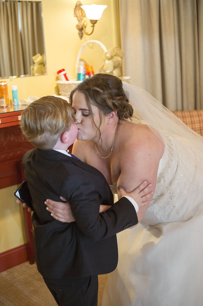 Bride kissing her son before her Plymouth wedding