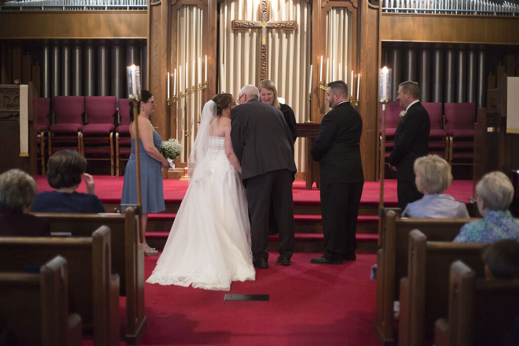 Father handing off the bride at Plymouth wedding