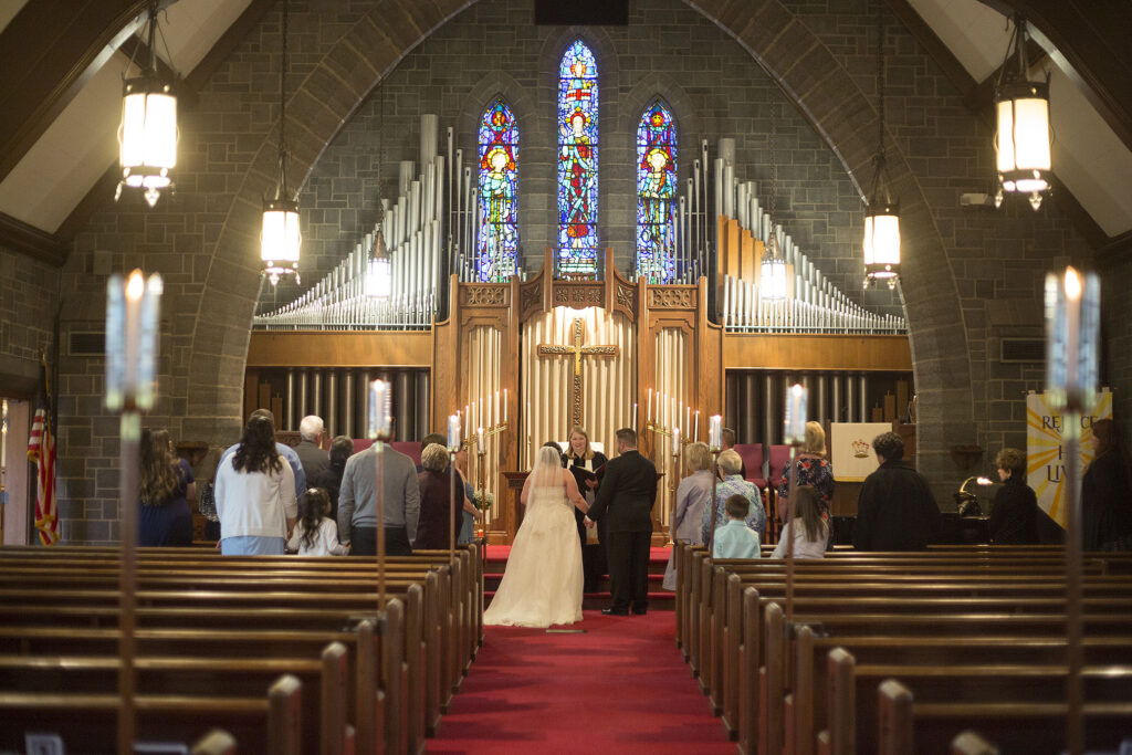 Plymouth wedding in front of gorgeous church organ